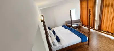 a bedroom with a bed in a room at COASTAL GRAND RESORT - KOTAGIRI in Kotagiri