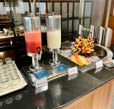 two drinks on a counter in a kitchen at Gokulam Park Guruvayur in Guruvāyūr