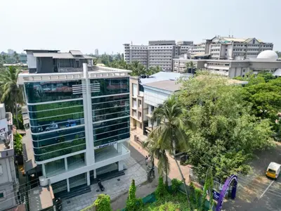 an aerial view of a building in a city at Hotel Bluebell in Kozhikode