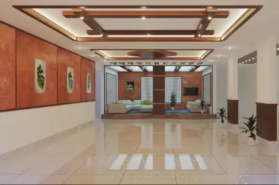 a lobby with a living room with couches and a ceiling at Platinum Airport Lounge by VVP in Nedumbassery