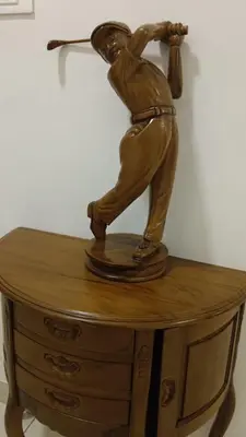 a statue of a baseball player swinging a bat at Thulasi Avenue Inn in Pollāchi