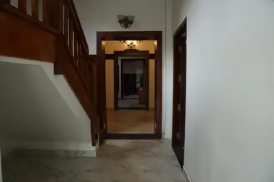 a hallway with a hallway leading into a house at Pear Tree Luxe Entire 3BHK Villa - Only For Family in Kotagiri