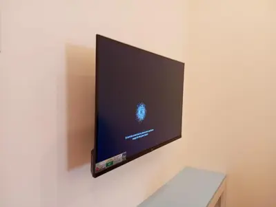 a flat screen tv hanging on a wall at Avalon Homes in Perintalmanna