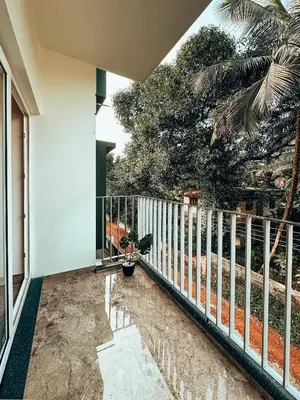 a balcony of a house with a fence at Avalon Homes in Perintalmanna
