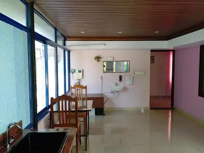 a bathroom with a sink and a toilet in a room at COZY Homes in Nedumbassery