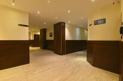 a lobby with a no entry sign on the wall at THE DAWN HOTEL in Mysore