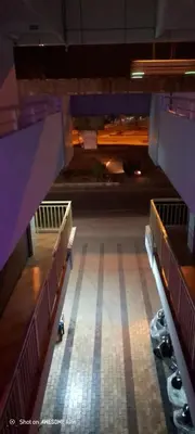 a view of an empty parking lot at night at Sky Residency Lodge in Trichūr