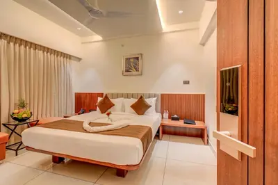 a bedroom with a large bed in a room at Hotel Hari Govindas Mysore - Explore the Heart of Mysore in Mysore