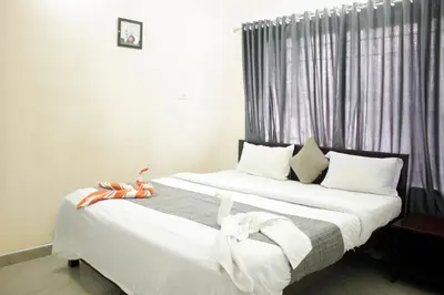 two beds sitting next to each other in a bedroom at Blue Lake in Kanthalloor
