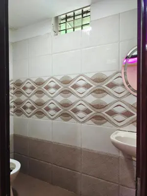 a bathroom with a sink and a toilet at geo gardens residency in Alwaye