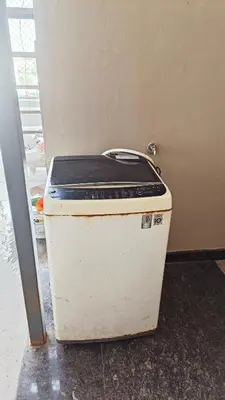 an old cooler sitting on the floor in a room at AR premium family homestay in Mysore