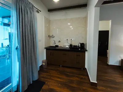 a bathroom with a sink and a counter in a room at Ooty Boulevard in Ooty