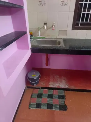 a small bathroom with a sink and a toilet at Shivalaya Stays - Coimbatore in Coimbatore