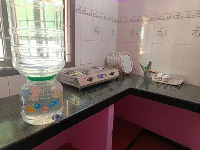 a bottle of water sitting on top of a counter at Shivalaya Stays - Coimbatore in Coimbatore
