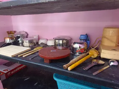 a counter top with various kitchen items on it at Shivalaya Stays - Coimbatore in Coimbatore