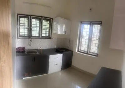 a kitchen with a sink and two windows at Lilly in Alattūr