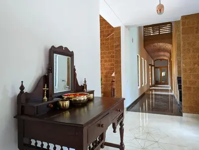 a bathroom with a dresser with a mirror on it at Red Rock Villa, Virajpet, Coorg in Virajpet
