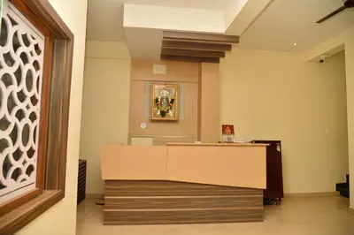 a lobby with a reception desk in a building at ARIVU LODGE AC in Anaimalai