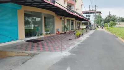 an empty street in front of a building at VVP Service Apartments in Nedumbassery