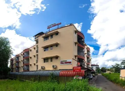 a tall building on the side of a road at VVP Service Apartments in Nedumbassery