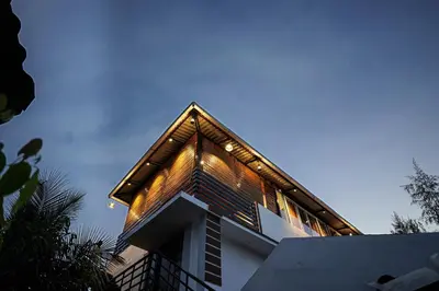 a house with a roof with lights on it at GREEN MOUNT RESORTS in Malaiyāndipattanam