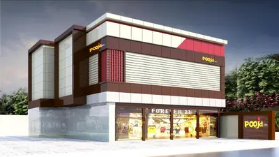 a rendering of a store front at POOJA inn in Guruvāyūr