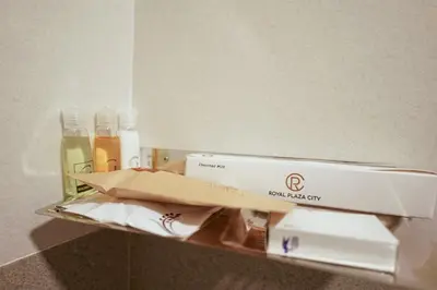 a box sitting on a shelf in a bathroom at Royal Plaza City in Kozhikode