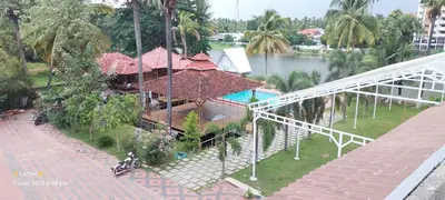 an overhead view of a house with a swimming pool at Udaya Resort in Palakkad