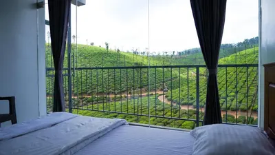 a bedroom with a bed and a view of a vineyard at Zen Vista in Vālpārai