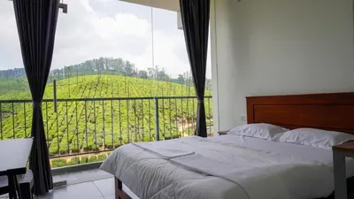 a bedroom with a bed and a view of a vineyard at Zen Vista in Vālpārai
