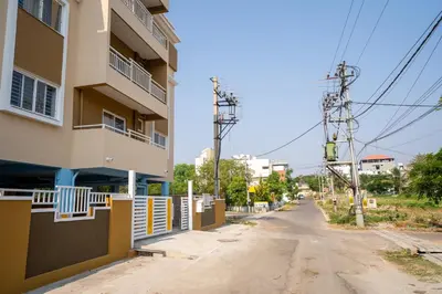 an empty street in front of a building at Elegance Serviced Apartment in Mysore