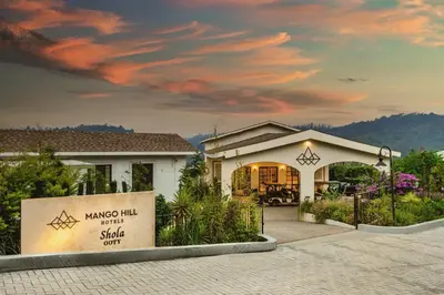 a house with a sign in front of it at Mango Hill Shola Ooty in Ooty