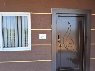 a door and a window on a building at Royal homes a3 in Kushālnagar