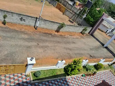 an overhead view of a park bench on a street at Royal homes a3 in Kushālnagar