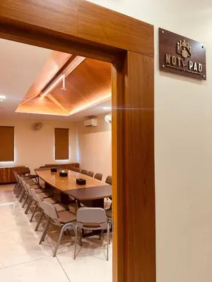 a conference room with a long table and chairs at Fortune Hills in Palakkad
