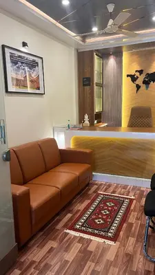 a living room with a couch and a bar at Bhoomiputra Mansion in Mysore