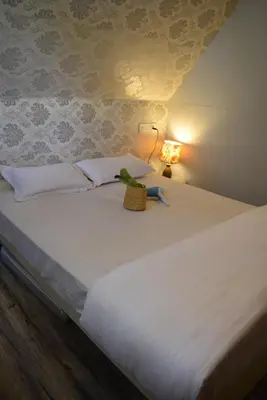 a bed with a stuffed animal sitting on top of it at IInfinity Kodaikanal in Kūkkāl