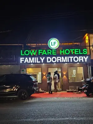 a low fare hotels family bathroom sign on a building at LOWFARE HOTELS in Kozhikode