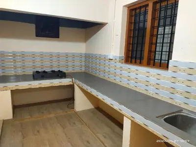 an empty room with a sink and a counter at Rest House @ Merlys Fruit Garden in Thattakād