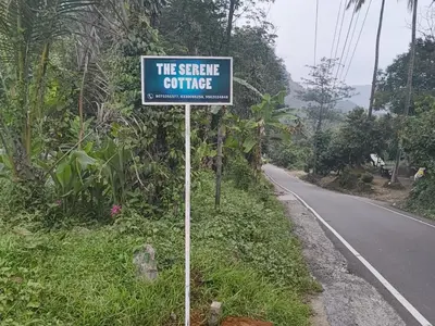 a sign on the side of a road at The Serene Cottage in Viripara