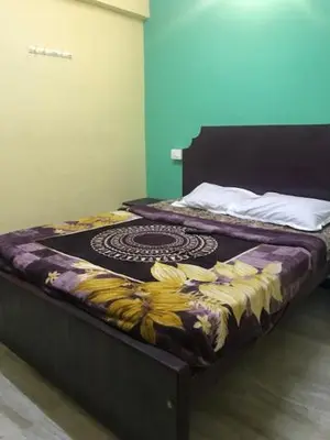 a bedroom with two beds with bananas on them at Le Apex misty stay in Ooty