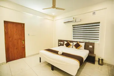 a bedroom with a large bed in a room at Sreeja Myst in Athirappilly
