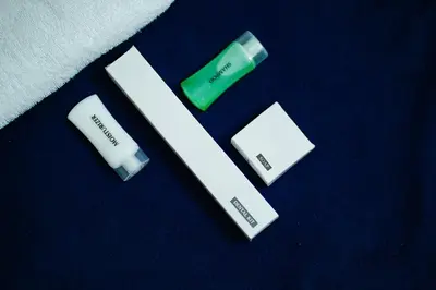 a close up of three batteries on a blue surface at Adam homes in Alwaye