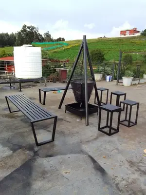 a park with benches and a swing and a basket at OOTY LIMRA HOLIDAY INN cottage in Ooty