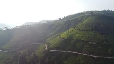 an aerial view of a mountain with a road on it at Casa de Selas in Coonoor