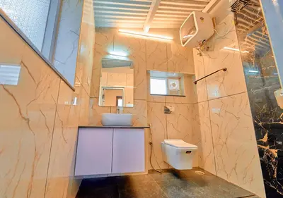 a bathroom with a sink and a toilet in it at Vintage Inglenook Premium Heritage Bungalow Ooty by VOYE HOMES - A Quiet Retreat Close to Ooty Town in Ooty