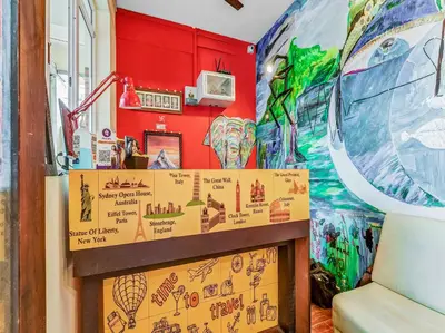 a room with a wall covered in graffiti at Sri Balaji castle in Coimbatore