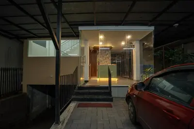 a house with a car parked in front of it at BR Residency in Trichūr