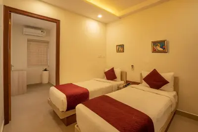 a hotel room with two beds in a room at BR Residency in Trichūr
