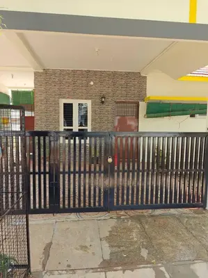 a black fence in front of a house at S R Luxurious Fully Ac 3 BHK Bunglow Mysore in Mysore